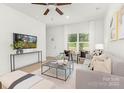 Bright living room featuring modern furnishings, neutral tones, and ample natural light at 222 Ventner Ct, Charlotte, NC 28214