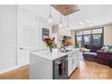 Bright open-concept kitchen has modern appliances, quartz counters, and transitions smoothly into the inviting living area at 2401 Euclid Ave # 306, Charlotte, NC 28203