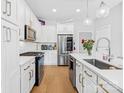 Lovely kitchen featuring white cabinets, quartz counters, stainless steel appliances, and a stylish subway tile backsplash at 2401 Euclid Ave # 306, Charlotte, NC 28203