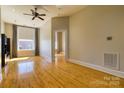 Open living area featuring hardwood floors and neutral paint at 300 S Main St # K, Salisbury, NC 28144