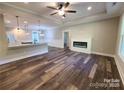 Spacious open-concept living room with fireplace and modern flooring at 404 Imperial Way, Albemarle, NC 28001