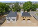 Aerial view of two new construction homes with paved driveways in a suburban community at 507 Bowman Rd, Charlotte, NC 28217