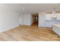Open concept living room featuring wood flooring, and an eat-in kitchen at 602 Banter Ln # 28, Cramerton, NC 28032