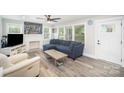 Bright living room featuring modern decor, ceiling fan and lots of natural light at 621 Bristol Dr, Statesville, NC 28677