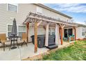 Relaxing outdoor patio area with hot tub, pergola, seating, and space for entertaining at 9205 Camberwell Rd, Mint Hill, NC 28227