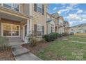 Townhouse row featuring sidewalks and inviting front doors, creating a sense of community at 1228 Liberty Bell Ct, Rock Hill, SC 29732