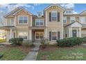 Charming townhouse featuring a well-maintained lawn and welcoming front entrance, creating a cozy curb appeal at 1228 Liberty Bell Ct, Rock Hill, SC 29732