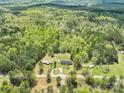 Extensive aerial view showcasing the property's location surrounded by lush forest and greenery at 1766 Duckwood Rd, Lancaster, SC 29720
