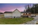 Spacious backyard showcasing a brick patio and a well-maintained lawn at 201 Indian Hill Rd, Union Grove, NC 28689