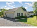 Home featuring an attached two-car garage and well-maintained landscaping at 202 Oakwood St, Stanfield, NC 28163