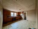 Spacious kitchen featuring ample cabinet space, a sink with a window view, and plenty of room for dining at 2124 W C St, Kannapolis, NC 28081