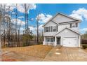 Beautiful two-story home with gray siding, manicured lawn, attached garage, and landscaping at 2808 Yurman Rd, Charlotte, NC 28214