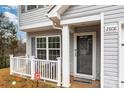 Inviting front porch featuring a white picket fence, seating, and a welcoming front door at 2808 Yurman Rd, Charlotte, NC 28214