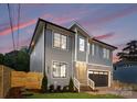 The side of the house showing the windows, gray siding, and fenced front yard at 2965 Beech Nut Rd, Charlotte, NC 28208