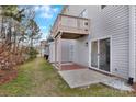 Backyard view with a deck overhead and concrete and brick paver patio at 3099 Windsor Trace Dr, Fort Mill, SC 29707