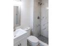 Bathroom features a white vanity and large walk-in shower with marble tiles and a mosaic floor at 315 Dunham Ave, Salisbury, NC 28146