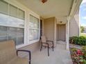Inviting porch with comfortable chairs offers a relaxing outdoor space, enhancing curb appeal at 3841 Shasta Cir, Clover, SC 29710