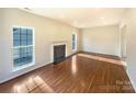 Bright living room featuring wood flooring and fireplace at 4910 Summerside Dr, Clover, SC 29710