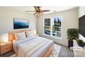 Cozy main bedroom with a ceiling fan, large windows, and neutral decor at 4910 Summerside Dr, Clover, SC 29710