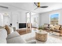 Bright living room with hardwood floors, a modern ceiling fan, and stylish furnishings at 5825 Ruth Dr, Charlotte, NC 28215
