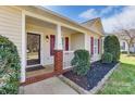 Inviting front porch with brick accents and decorative landscaping at 1362 Copper Creek Ln, Fort Mill, SC 29715