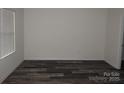 The bedroom features durable flooring and a window that provides natural light at 248 Mills Ave, Troutman, NC 28166