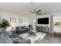 Cozy living room featuring comfortable seating, a ceiling fan, and stylish decor for relaxed living at 2638 Trinity St, Monroe, NC 28110