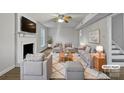 Bright, airy living room with neutral tones, a fireplace, and ample seating perfect for gatherings at 316 Epperstone Ln, Matthews, NC 28105