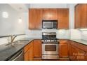 Features stainless steel appliances, granite countertops, and ample storage space, perfect for cooking enthusiasts at 3920 Sharon Rd # 208, Charlotte, NC 28211