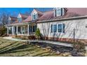Charming home with a long, covered front porch and manicured landscaping, creating a welcoming curb appeal at 468 White Oak Branch Rd, Statesville, NC 28625