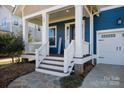 Inviting front porch features white railings, decorative columns, and a welcoming entrance at 827 Bluff Loop Rd, Rock Hill, SC 29730