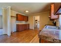 Well-lit kitchen with wooden cabinets, laminate countertops, and a stainless steel sink at 828 Carver St, Shelby, NC 28152