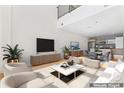 Spacious living room features an entertainment center with open floorplan to the kitchen at 1133 Metropolitan Ave # 310, Charlotte, NC 28204