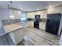 Spacious kitchen featuring granite countertops and ample cabinet space at 2034 Bess Town Rd, Bessemer City, NC 28016