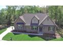 Beautiful single-Gathering home with brick facade, manicured lawn, and welcoming front entrance at 2069 Landry Ln # 233, Rock Hill, SC 29732