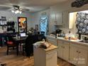 Functional kitchen with island, dining area, and ample counter space at 22 Heritage View Rd, Hickory, NC 28601