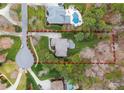 An aerial view shows the property lines in red, highlighting the generous lot size and backyard at 308 Covington Xing, Weddington, NC 28104