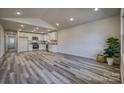 Open floor plan featuring luxury vinyl flooring, a modern kitchen, and vaulted ceilings at 502 9Th Sw Ave, Conover, NC 28613