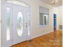 Elegant foyer featuring hardwood floors and a decorative front door with sidelights at 912 Silver Charm Ln, York, SC 29745