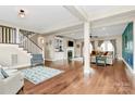 Open living room with hardwood floors, fireplace, and ample natural light at 1011 Duntov Dr, Monroe, NC 28110
