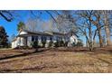 View of the side of the house in a wooded lot at 1116 Medlin Rd, Monroe, NC 28112