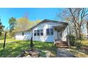 Charming front entrance features a small porch with steps, perfect for adding a personal touch at 1116 Medlin Rd, Monroe, NC 28112