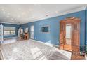 Open concept living room with blue walls, hardwood floors, neutral carpet and natural lighting at 1321 Pennington Nw Pl, Concord, NC 28027