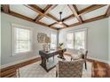 Cozy home office featuring a decorative ceiling, large windows, and hardwood floors for a professional workspace at home at 165 Blue Ridge Trl, Mooresville, NC 28117