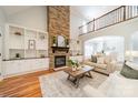 Bright living room with a stone fireplace, built-in shelving, and an open layout perfect for entertaining and Gathering gatherings at 165 Blue Ridge Trl, Mooresville, NC 28117