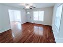 Bright living room featuring gleaming hardwood floors, fresh paint and abundant natural light at 1806 Bringle Ferry Rd, Salisbury, NC 28146