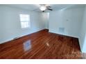 Spacious living room with hardwood floors, a ceiling fan, and large window for lots of light at 1806 Bringle Ferry Rd, Salisbury, NC 28146