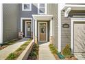 Inviting front entrance of townhome with attractive landscaping and walkway leading to the front door at 2330 Hedgecliff Rd # 157, Kannapolis, NC 28025