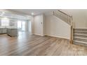 Open-concept living room with wood flooring and stairs to the upper level at 2330 Hedgecliff Rd # 157, Kannapolis, NC 28025