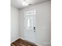 Bright entryway featuring a white door with glass inserts, seamlessly blending style with functionality at 2350 Hedgecliff Rd, Kannapolis, NC 28025